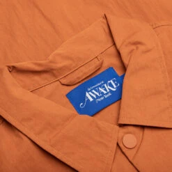 King Logo Twill Coaches Jacket - Rust -Fashion Clothing Store Awake NY King Logo Twill Coaches Jacket Rust AWK SP23 OT007 RUS 05 28 23 Feature KN 10