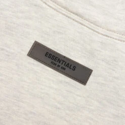 Essentials Core Relaxed Mockneck - Light Oatmeal -Fashion Clothing Store Fear of God Essentials Core Relaxed Mockneck Light Oatmeal 192BT212261F 07 25 22 Feature JM 3