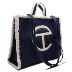 UGG X Telfar Large Shopper - Denim 10 UGG X Telfar Large Shopper - Denim -Fashion Clothing Store UGG x Telfar Large Shopper Denim 1152252 DEN 09 07 23 Feature VR 10 94a282ea 7bef 4885 9d99 df15a5c369e7